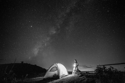 Low angle view of tent against sky at night