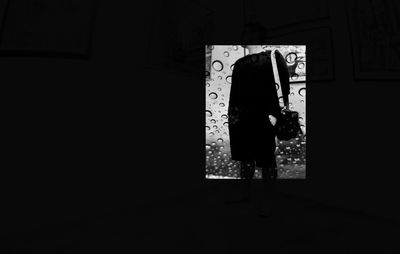 Woman standing in corridor