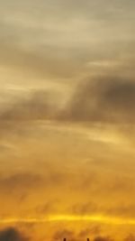 Low angle view of cloudy sky at sunset