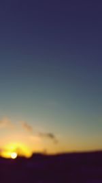 Scenic view of silhouette landscape against clear sky during sunset