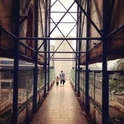 Woman walking in tunnel