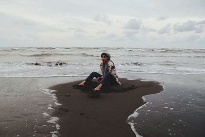 Woman standing on beach