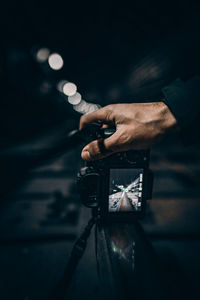 Close-up of hand holding camera