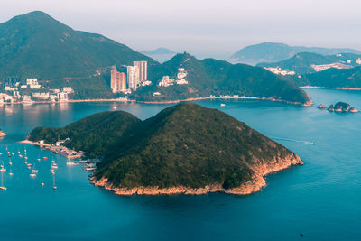 Panoramic view of sea and buildings against sky