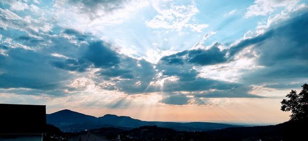 Scenic view of silhouette mountains against sky during sunset