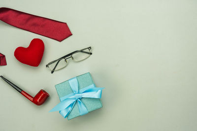 High angle view of heart shape on paper against white background