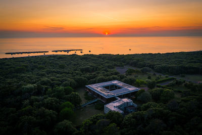 High angle view of sea against sky during sunset
