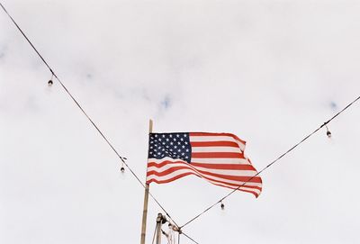 Low angle view of flag against sky