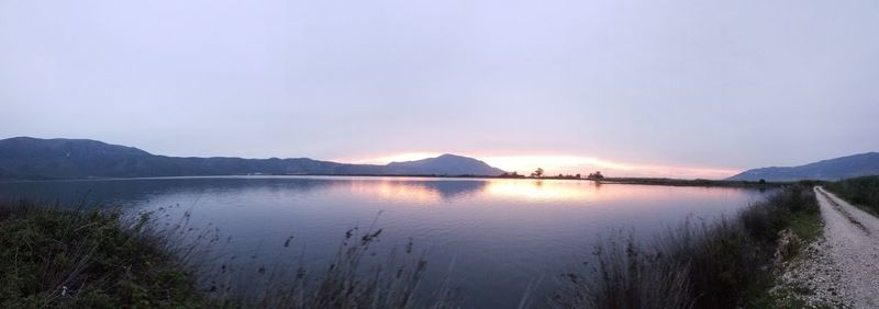 Scenic view of lake against sky during sunset