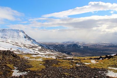 Scenic view of snowcapped mountains against sky