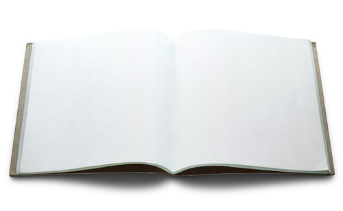 Close-up of open book against white background