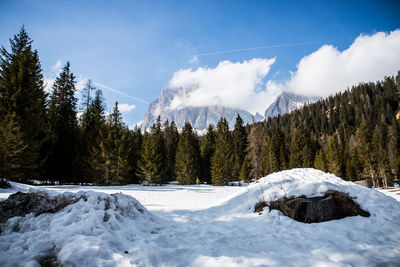 Scenic view of snow covered mountains against sky