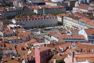 High angle view of red tiled roof buildings in city