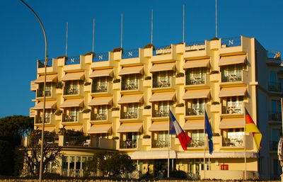 Low angle view of buildings against blue sky