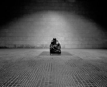 Surface level of man sitting outdoors