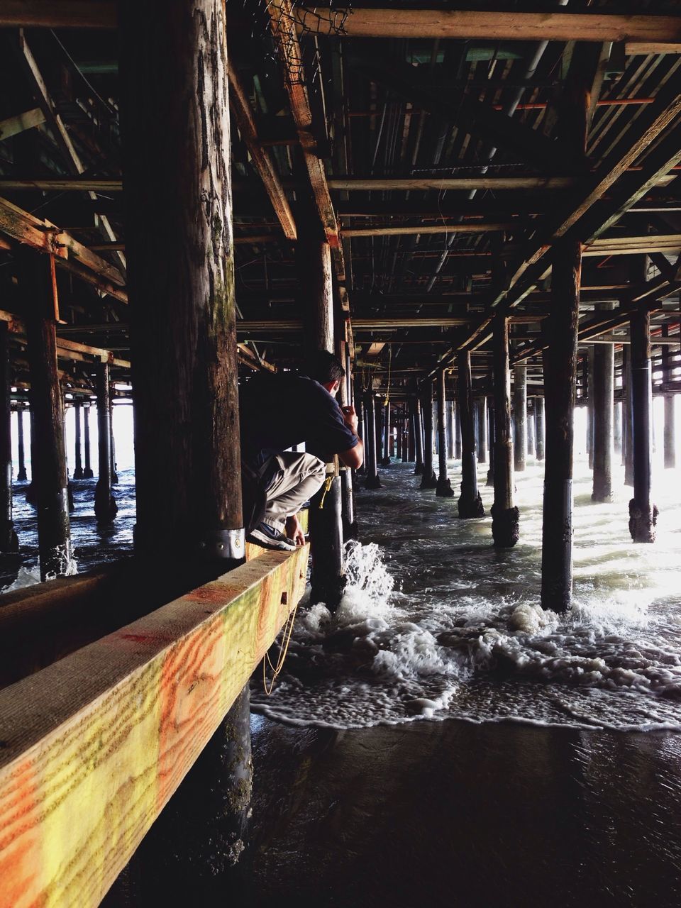 built structure, architecture, water, architectural column, pier, wood - material, building exterior, bridge - man made structure, reflection, column, waterfront, support, in a row, diminishing perspective, the way forward, below, connection, no people, outdoors, day