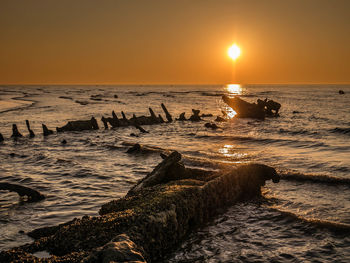 Scenic view of sea against sky during sunset