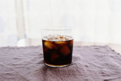 Close-up of tea in glass on table