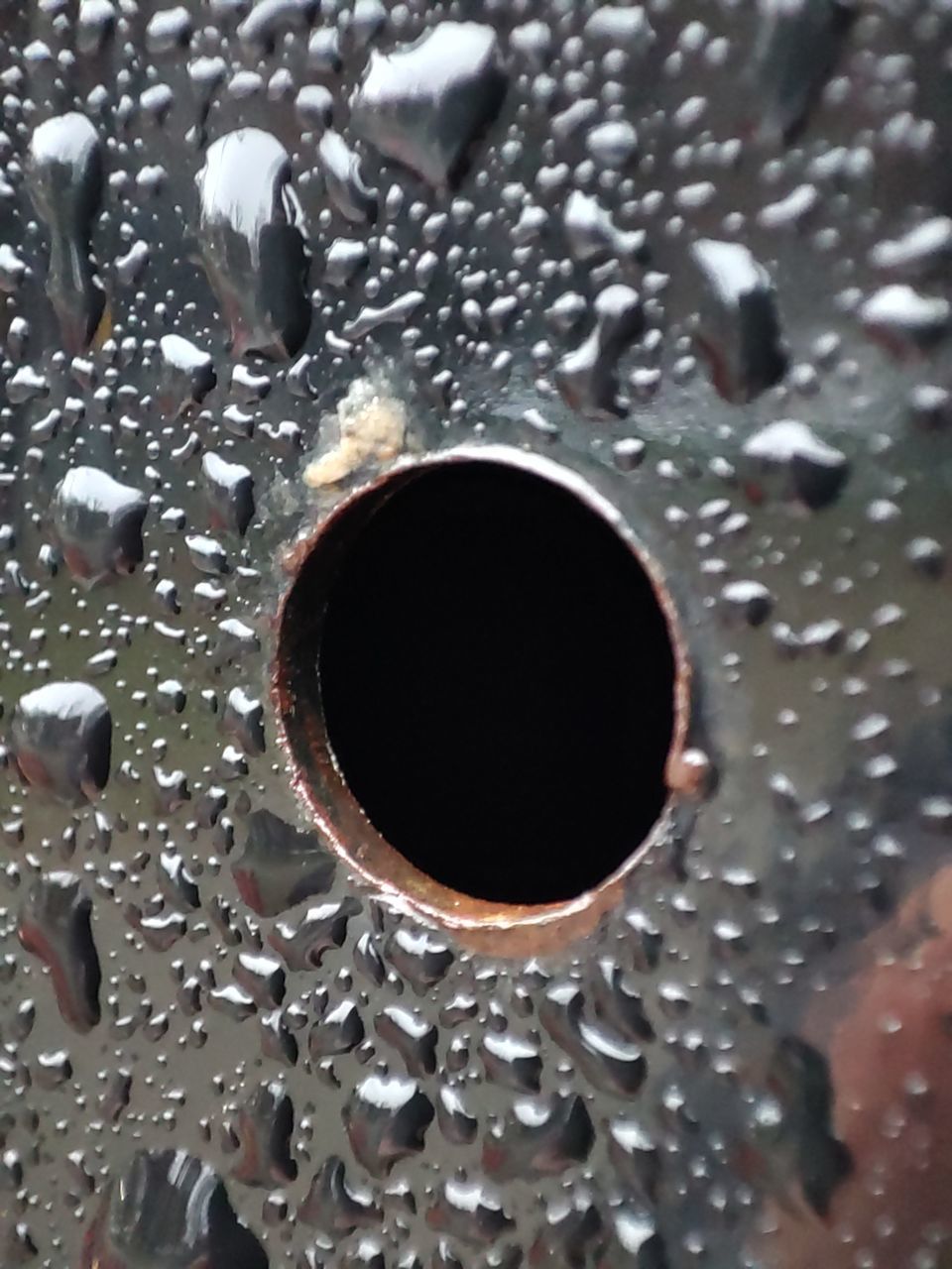 FULL FRAME SHOT OF WET GLASS WITH RAINDROPS