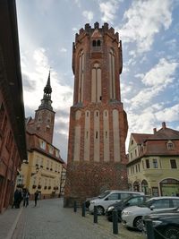 Panoramic view of buildings in city against sky