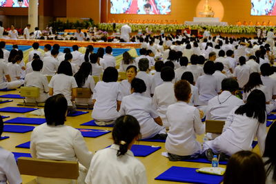 Group of people sitting in temple