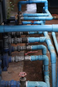 Close-up of pipes against blue sky