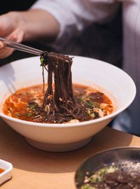 Close-up of man preparing food