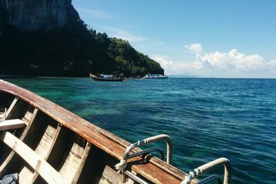 View of boats in sea during sunny day