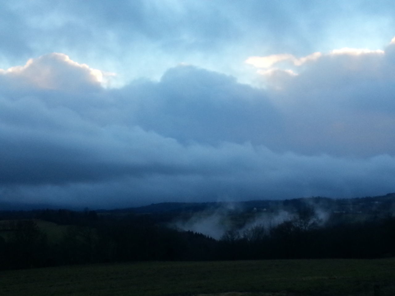 tranquil scene, scenics, tranquility, sky, landscape, beauty in nature, cloud - sky, nature, cloudy, mountain, weather, cloud, idyllic, field, non-urban scene, horizon over land, mountain range, outdoors, remote, fog