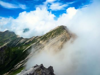 Scenic view of waterfall against sky