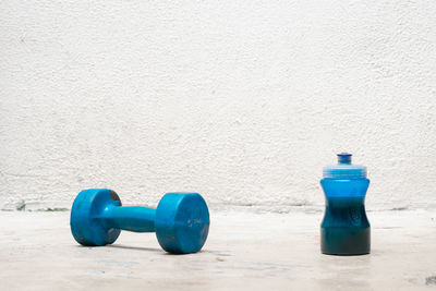 Close-up of dumbbells on floor