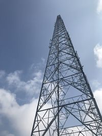 Low angle view of communications tower against sky