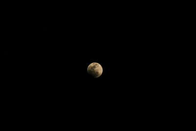 Low angle view of moon against sky at night