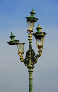 Low angle view of street light against sky
