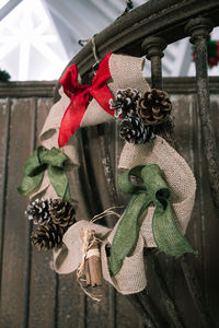 Close-up of christmas decoration hanging on wood