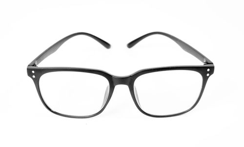 Close-up of eyeglasses against white background