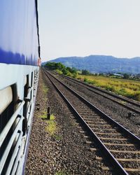 Railroad tracks against clear sky