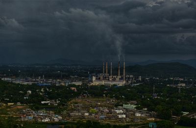 High angle view of cityscape against cloudy sky