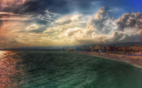 Panoramic view of beach against sky during sunset