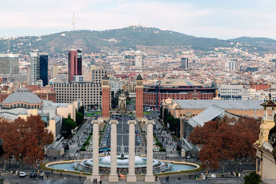 High angle view of buildings in city against sky