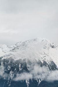 Scenic view of snow covered mountains against sky