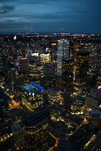 High angle view of illuminated city buildings at night