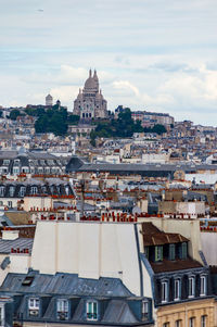 Paris cityscape from above. montmartre hill and sacre coer church stand out in the view