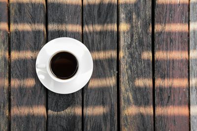 High angle view of coffee cup on table