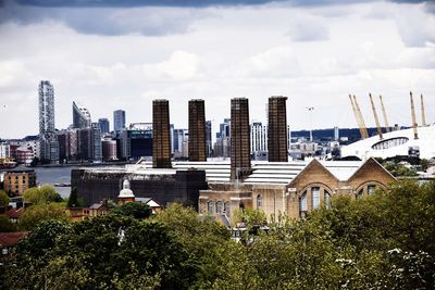 Buildings in city against sky