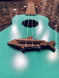 High angle view of guitar on table