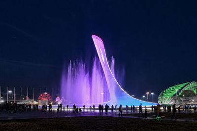 Panoramic view of crowd at night