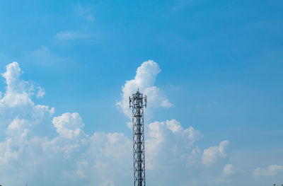 Low angle view of communications tower against sky