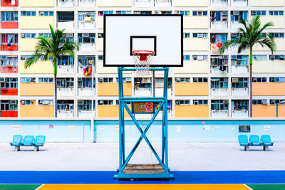 Low angle view of basketball hoop against blue sky