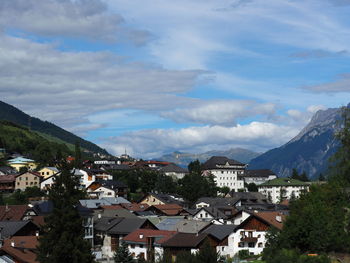 Houses in town against sky